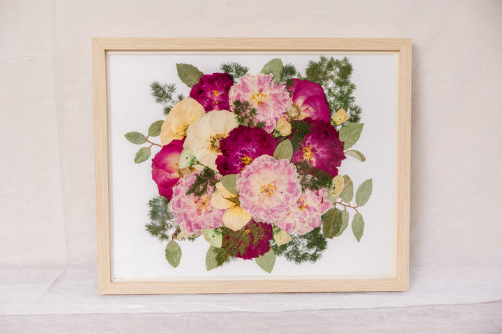 Pressed wedding bouquet in a natural wood frame