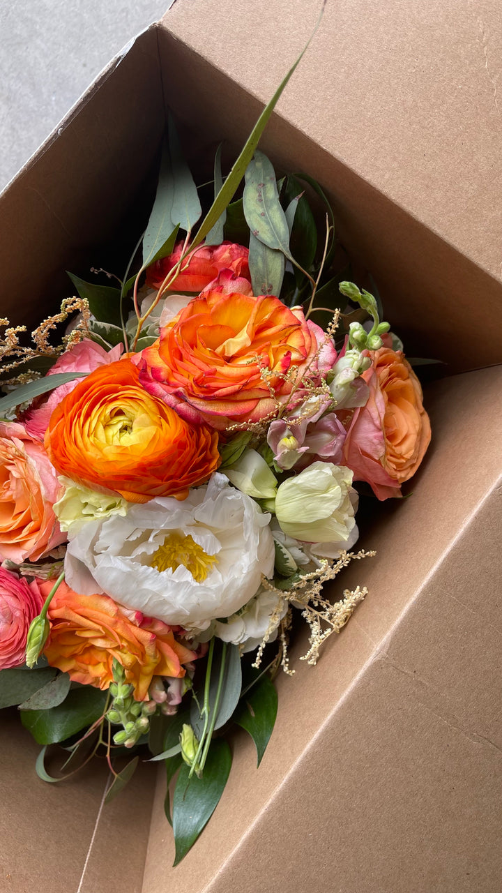 Fresh wedding bouquet in shipping box being sent to the Element Design Co for a wedding preservation keepsake
