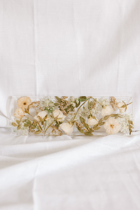 Pressed flowers in a 13x4 inch display tray made by Element Preservation