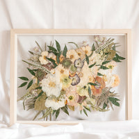 Wedding flowers preserved in time in a floating glass frame made of natural wood. 
