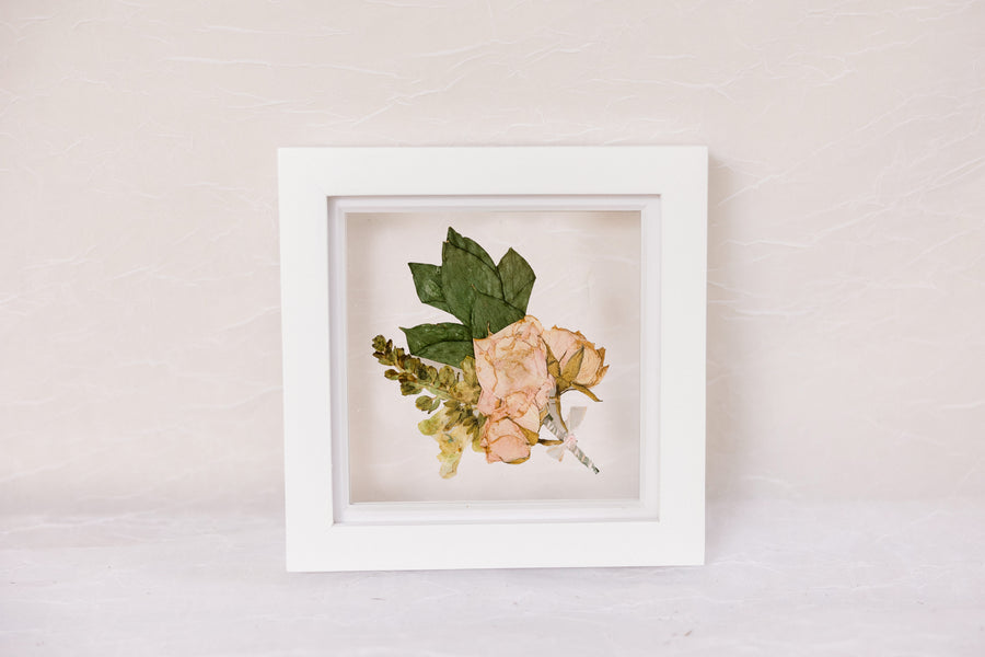 6x6, mini white wood frame with a pressed boutonniere.