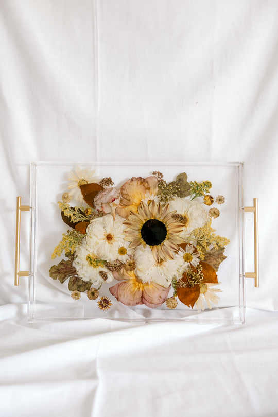 An arrangement of pressed flowers in a serving tray made from a preserved bouquet - Element Design Co, Element Preservation