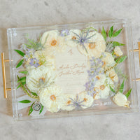 Rectangle pressed flower resin serving tray with gold handles and multiple additions.