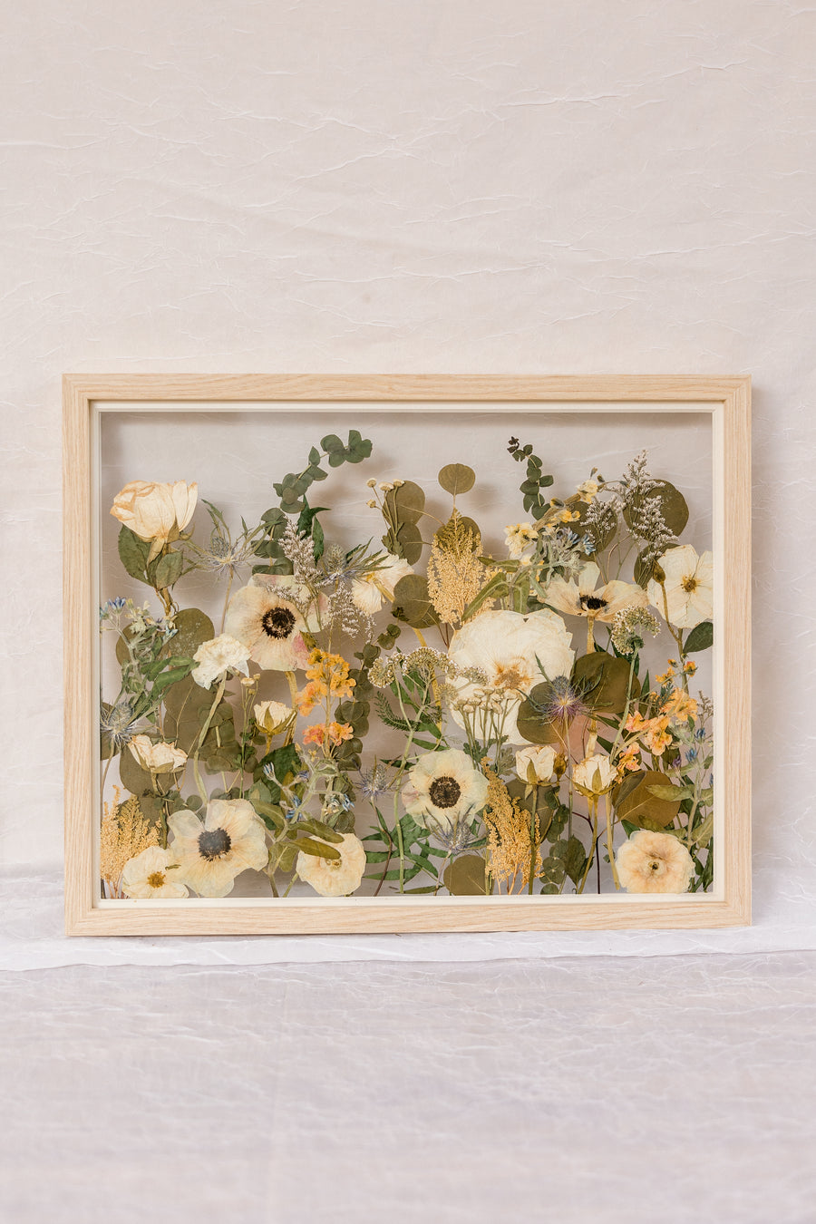 16x20 natural wood frame with pressed wedding flower horizontal field style design